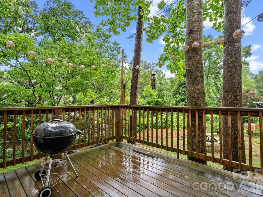 4 Beechwood Lakes Drive, Hendersonville, NC 28792.  MLS# CAR4380923, YatesRealty ID 46410. Step onto the deck outside your kitchen to access your grilling deck!