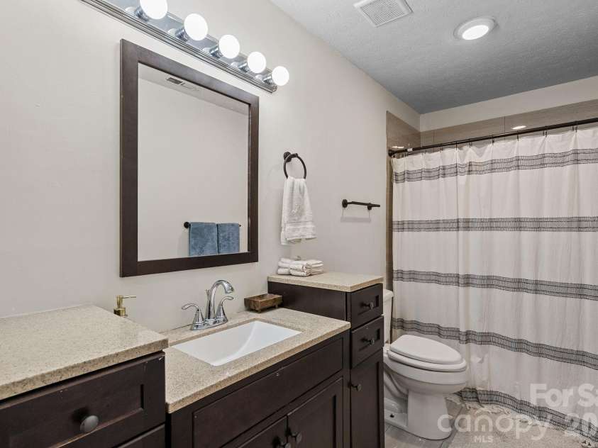 4 Beechwood Lakes Drive, Hendersonville, NC 28792.  MLS# CAR4380923, YatesRealty ID 46410. The hall bathroom is also functional and super nice.