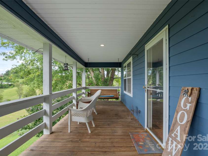 271 Breton Ridge Road, Leicester, NC 28748.  MLS# CAR4284121, YatesRealty ID 4642. Extra Large Upper Level Front Porch