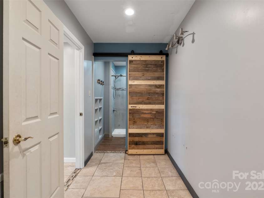 271 Breton Ridge Road, Leicester, NC 28748.  MLS# CAR4284121, YatesRealty ID 4642. Lower level dressing room/flex space