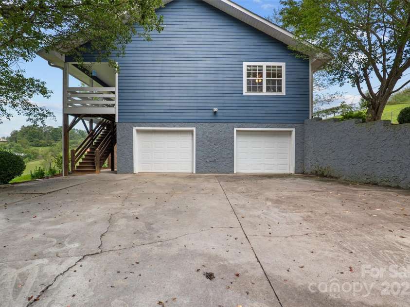 271 Breton Ridge Road, Leicester, NC 28748.  MLS# CAR4284121, YatesRealty ID 4642. Lower Level Driveway with Garage Access