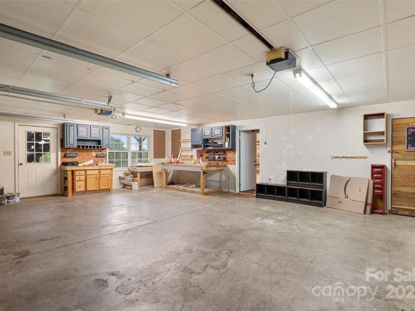 271 Breton Ridge Road, Leicester, NC 28748.  MLS# CAR4284121, YatesRealty ID 4642. Oversized 2 car garage