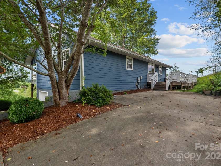 271 Breton Ridge Road, Leicester, NC 28748.  MLS# CAR4284121, YatesRealty ID 4642. Upper Level parking area with kitchen access