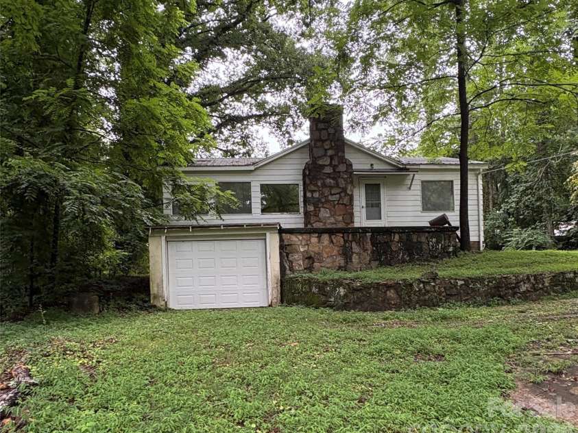 912 Halstead Boulevard, Hendersonville, NC 28791.  MLS# CAR4407762, YatesRealty ID 46423. Side view with Garage