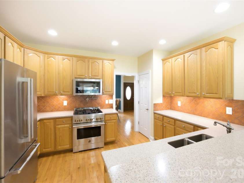 4006 Old Pageland Marshville Road, Wingate, NC 28174.  MLS# CAR4416227, YatesRealty ID 46432. The kitchen flows easily into the dining room, making it simple to move from everyday meals to hosting family and friends. It’s a layout that keeps everyone connected—whether you’re cooking, setting the tab