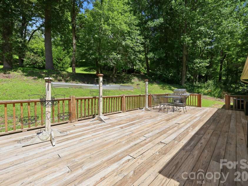 339 Indian Hills Loop, Waynesville, NC 28786.  MLS# CAR4417472, YatesRealty ID 46453. Back deck patio