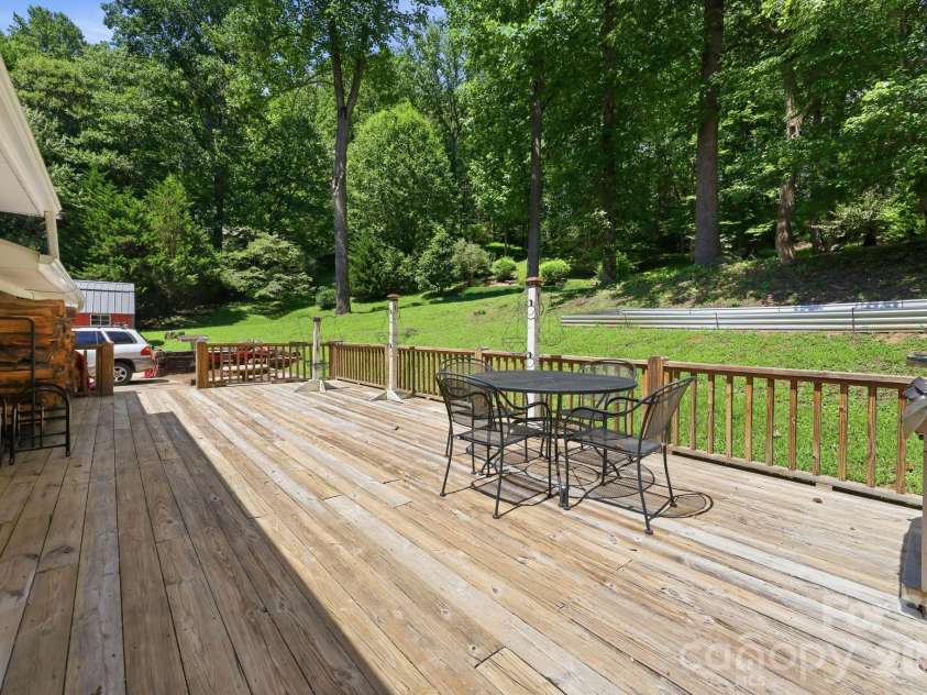 339 Indian Hills Loop, Waynesville, NC 28786.  MLS# CAR4417472, YatesRealty ID 46453. Back deck patio