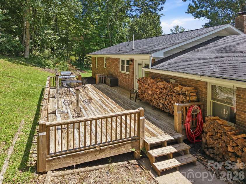 339 Indian Hills Loop, Waynesville, NC 28786.  MLS# CAR4417472, YatesRealty ID 46453. Back patio deck