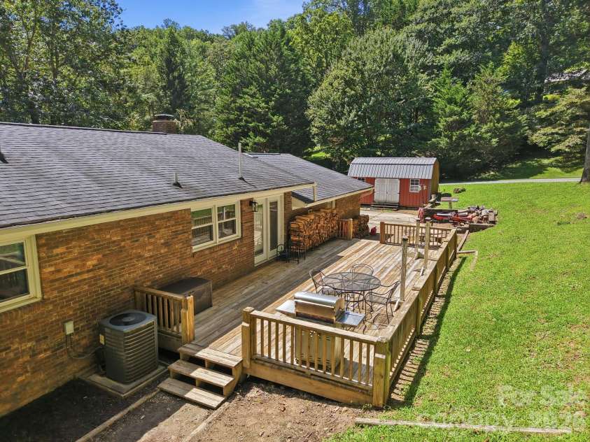 339 Indian Hills Loop, Waynesville, NC 28786.  MLS# CAR4417472, YatesRealty ID 46453. Back Patio deck