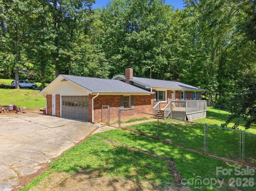 339 Indian Hills Loop, Waynesville, NC 28786.  MLS# CAR4417472, YatesRealty ID 46453. Driveway to garage
