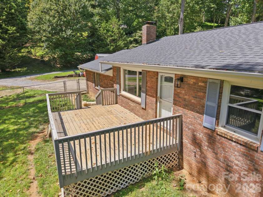 339 Indian Hills Loop, Waynesville, NC 28786.  MLS# CAR4417472, YatesRealty ID 46453. Front of house deck