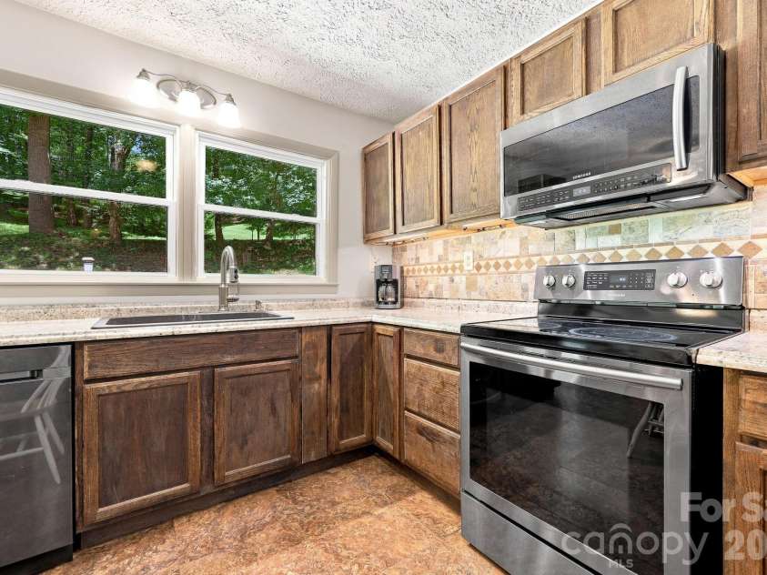 339 Indian Hills Loop, Waynesville, NC 28786.  MLS# CAR4417472, YatesRealty ID 46453. Kitchen 1