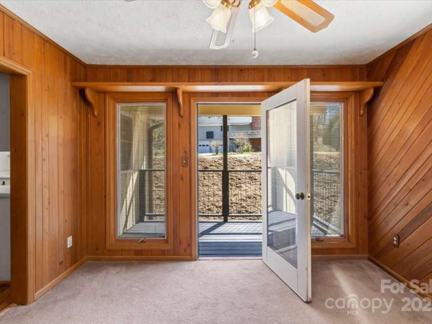 10 W Baird Mountain Road, Asheville, NC 28804.  MLS# CAR4234324, YatesRealty ID 4646. Deck off of sunroom