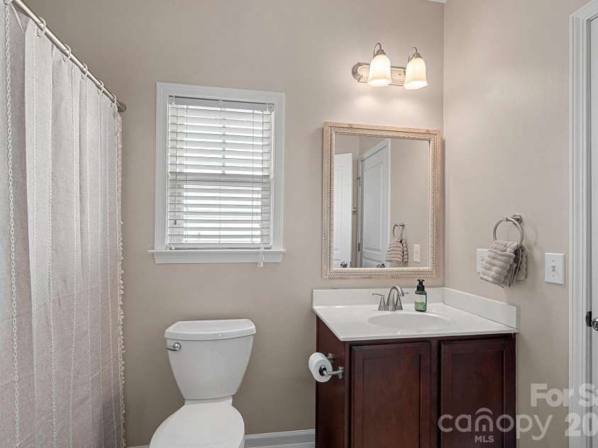 135 Rainberry Drive, Mooresville, NC 28117.  MLS# CAR4345698, YatesRealty ID 4649. Main-floor full bath conveniently located next to guest bedroom or office