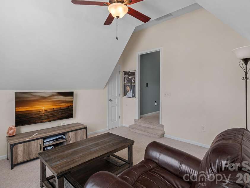 135 Rainberry Drive, Mooresville, NC 28117.  MLS# CAR4345698, YatesRealty ID 4649. Spacious flex room ready for movie nights, hobbies, or versatile family use