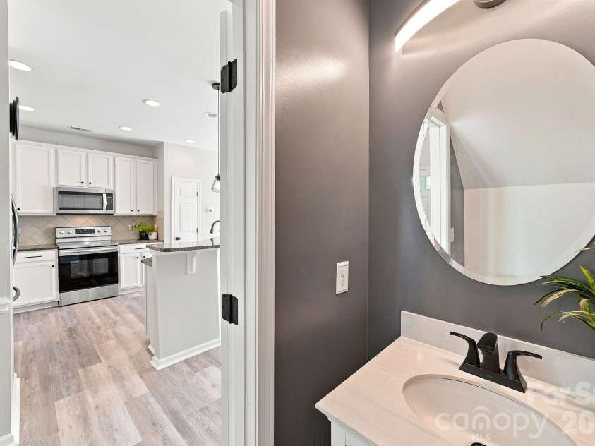 149 Leyton Loop, Mooresville, NC 28117.  MLS# CAR4416765, YatesRealty ID 46491. Half bathroom downstairs