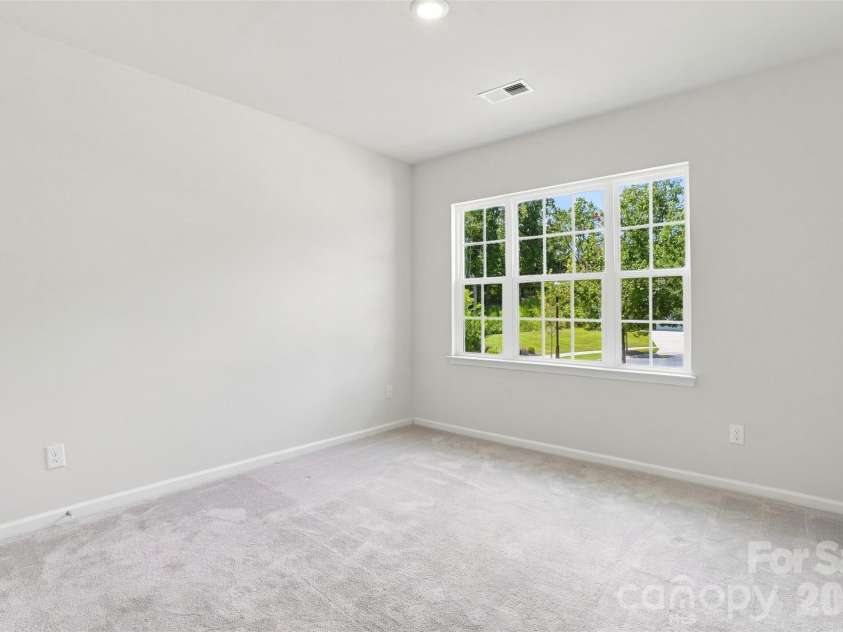3065 Rosseau Lane, Mount Holly, NC 28120.  MLS# CAR4417646, YatesRealty ID 46493. Main level secondary bedroom