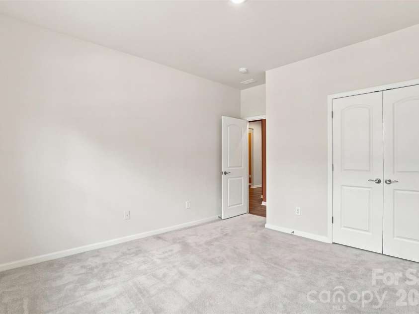 3065 Rosseau Lane, Mount Holly, NC 28120.  MLS# CAR4417646, YatesRealty ID 46493. Main level secondary bedroom
