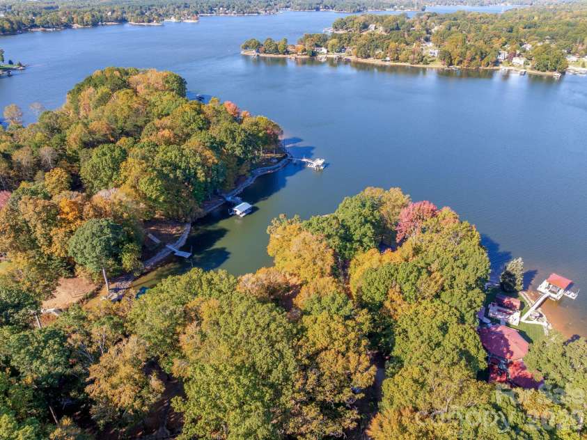 1168 Fern Hill Road, Mooresville, NC 28117.  MLS# CAR4351598, YatesRealty ID 4651. Aerial of the lake over the property
