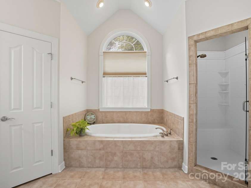 1314 Crooked Stick Drive, Rock Hill, SC 29730.  MLS# CAR4310285, YatesRealty ID 46526. Spa-like primary bath with toilet closet and walk in shower