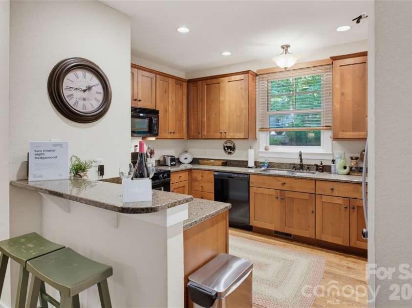 298 Hedgewood Drive, Tuckasegee, NC 28783.  MLS# CAR4393435, YatesRealty ID 46529. Bar and seating