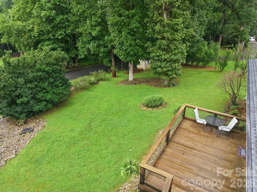 62 Hunters Field Lane, Mills River, NC 28759.  MLS# CAR4407487, YatesRealty ID 46548. Large front yard with mature trees