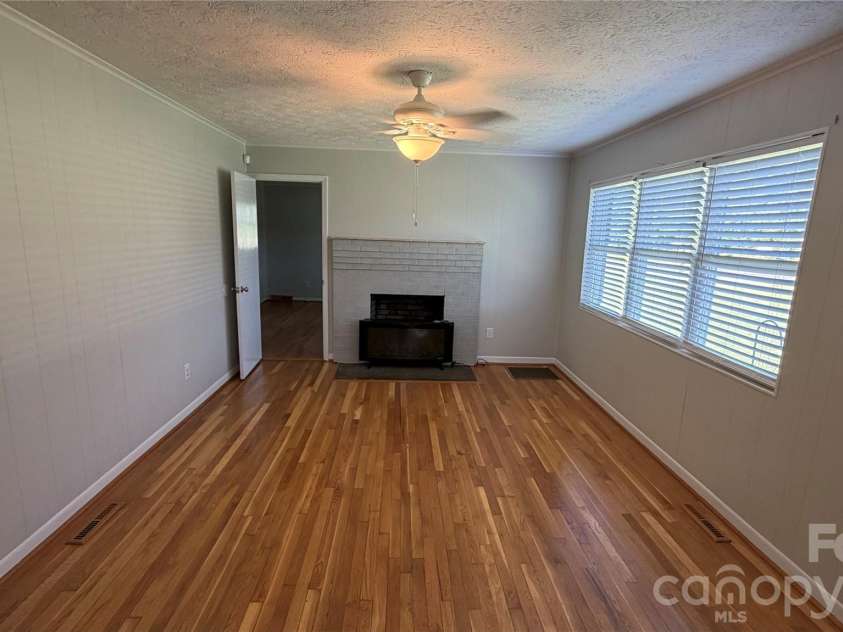2372 Jamestown Road, Morganton, NC 28655.  MLS# CAR4417833, YatesRealty ID 46552. Living room with fireplace