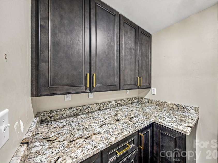 87 Catatoga Trail, Marion, NC 83452.  MLS# CAR4403584, YatesRealty ID 46554. Built-in cabinetry and stone countertop