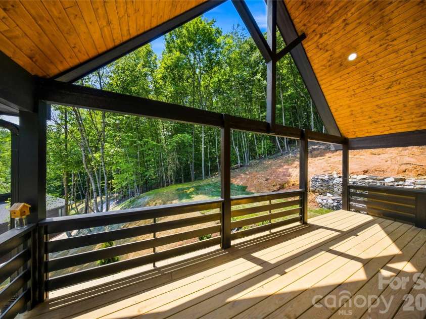 87 Catatoga Trail, Marion, NC 83452.  MLS# CAR4403584, YatesRealty ID 46554. Expansive covered back porch
