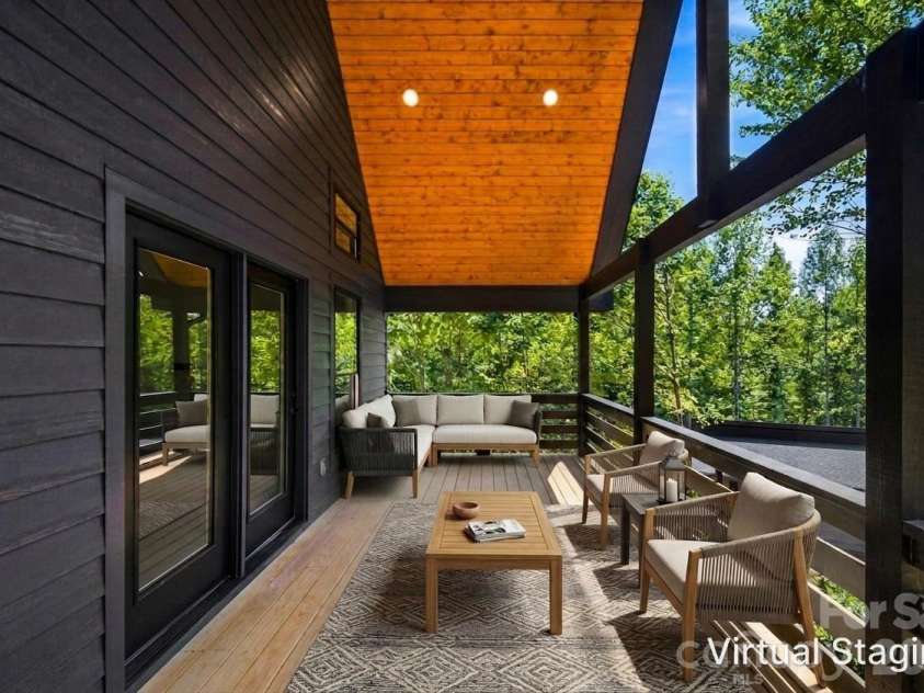 87 Catatoga Trail, Marion, NC 83452.  MLS# CAR4403584, YatesRealty ID 46554. Expansive deck for outdoor living– virtually staged
