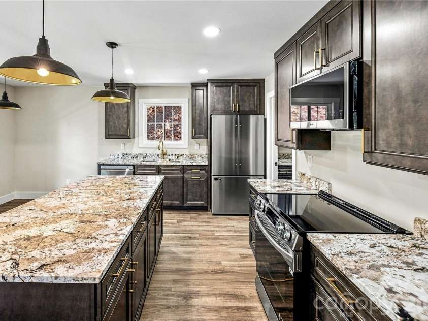 87 Catatoga Trail, Marion, NC 83452.  MLS# CAR4403584, YatesRealty ID 46554. Kitchen with oversized island