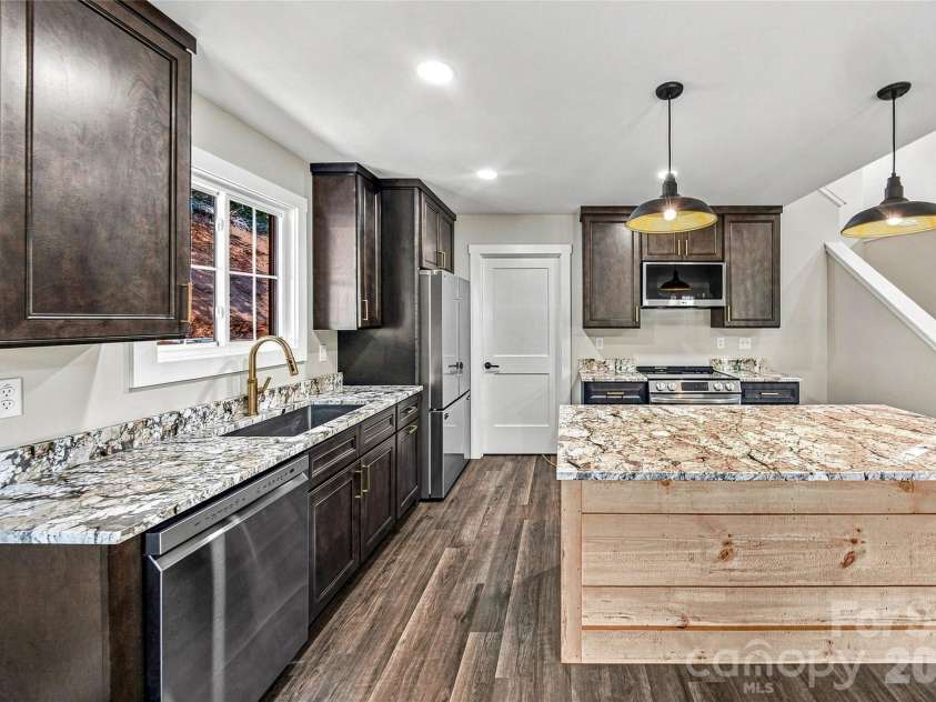 87 Catatoga Trail, Marion, NC 83452.  MLS# CAR4403584, YatesRealty ID 46554. Spacious kitchen with abundant workspace