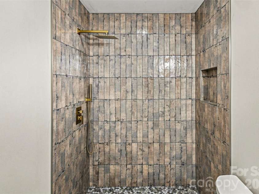 87 Catatoga Trail, Marion, NC 83452.  MLS# CAR4403584, YatesRealty ID 46554. Tiled walk-in shower