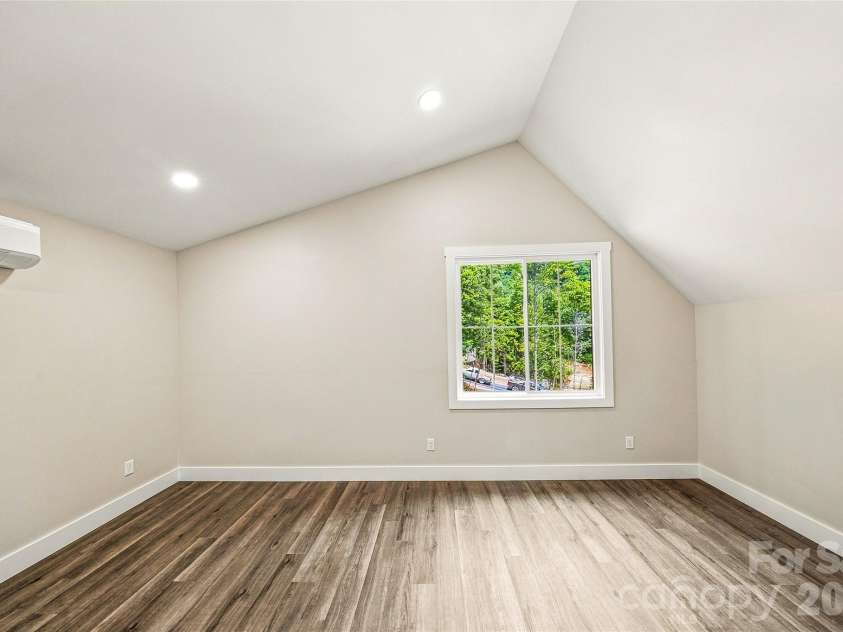 87 Catatoga Trail, Marion, NC 83452.  MLS# CAR4403584, YatesRealty ID 46554. Vaulted upper-level bedroom