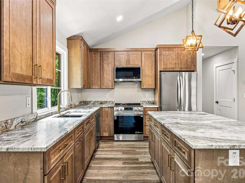 60 Catatoga Trail, Marion, NC 83452.  MLS# CAR4403563, YatesRealty ID 46556. Kitchen with stainless appliances