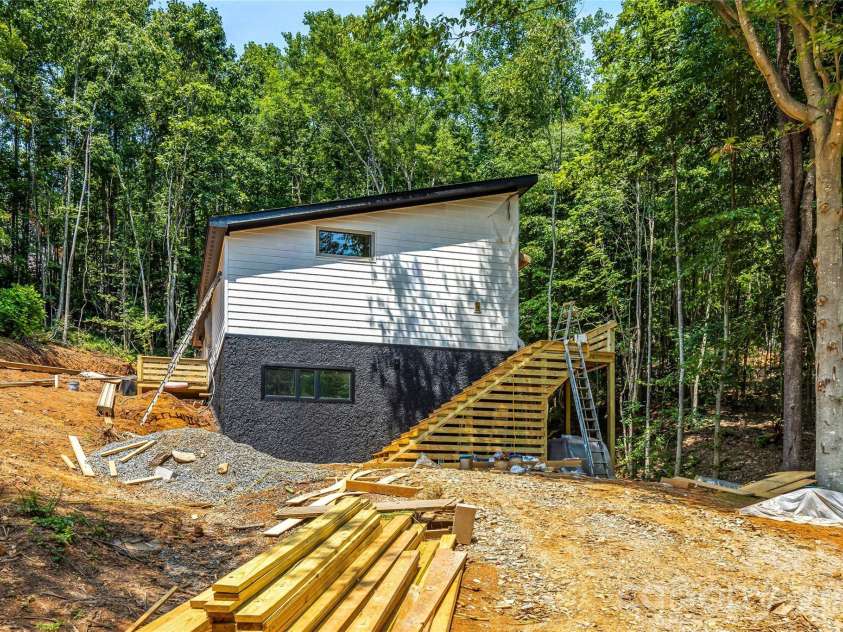 119 Catatoga Trail, Marion, NC 83452.  MLS# CAR4403608, YatesRealty ID 46557. Home nestled among the trees by stream