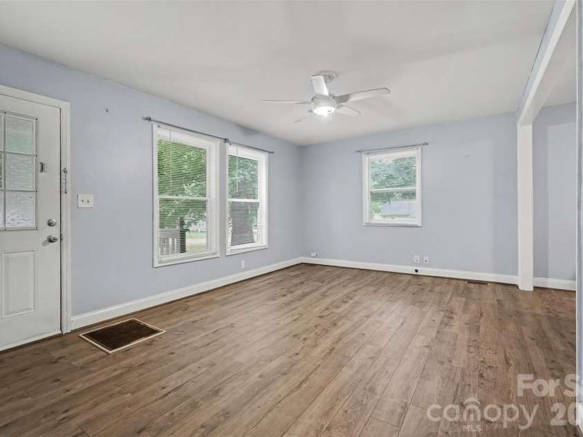 802 Stowe Drive, Lowell, NC 28098.  MLS# CAR4417684, YatesRealty ID 46559. Entryway and living room