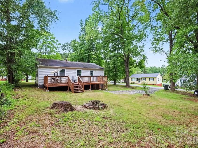 802 Stowe Drive, Lowell, NC 28098.  MLS# CAR4417684, YatesRealty ID 46559. Expansive backyard