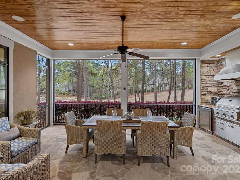 138 Great Point Drive, Mooresville, NC 28117.  MLS# CAR4242736, YatesRealty ID 4656. Outdoor kitchen & motorized screens