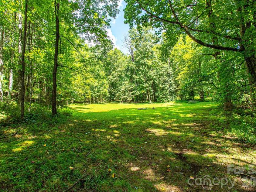 570 Flat Creek Valley Road, Lake Toxaway, NC 28747.  MLS# CAR4416431, YatesRealty ID 46565. Back field