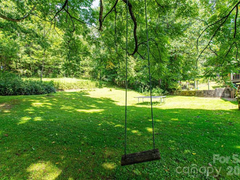 570 Flat Creek Valley Road, Lake Toxaway, NC 28747.  MLS# CAR4416431, YatesRealty ID 46565. Back yard