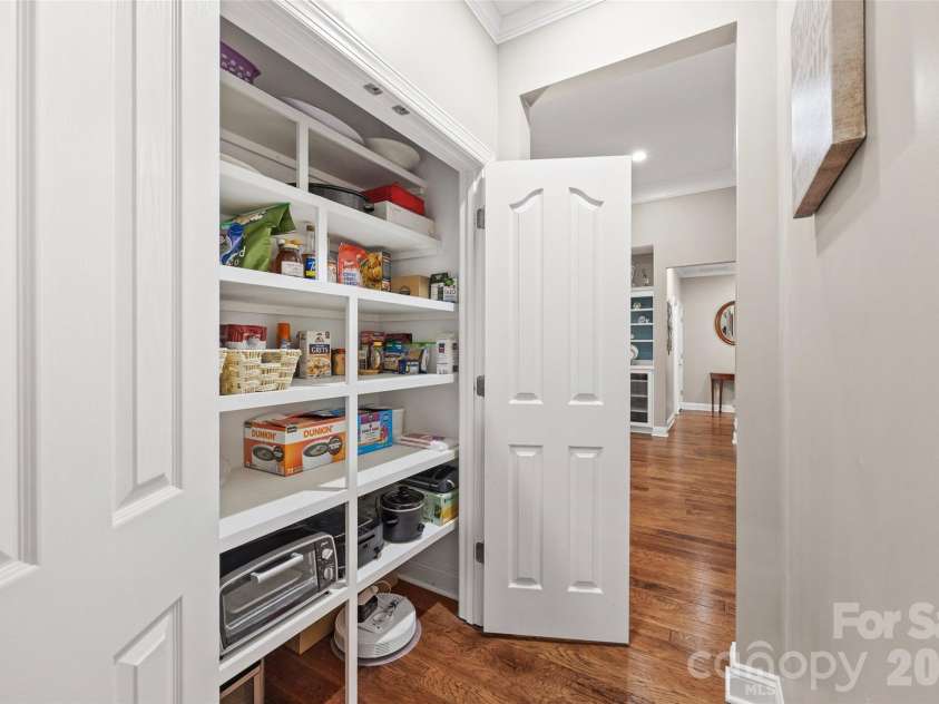 771 Cherry Hills Place, Rock Hill, SC 29730.  MLS# CAR4417475, YatesRealty ID 46566. Custom built pantry with wood shelves. Space for everything