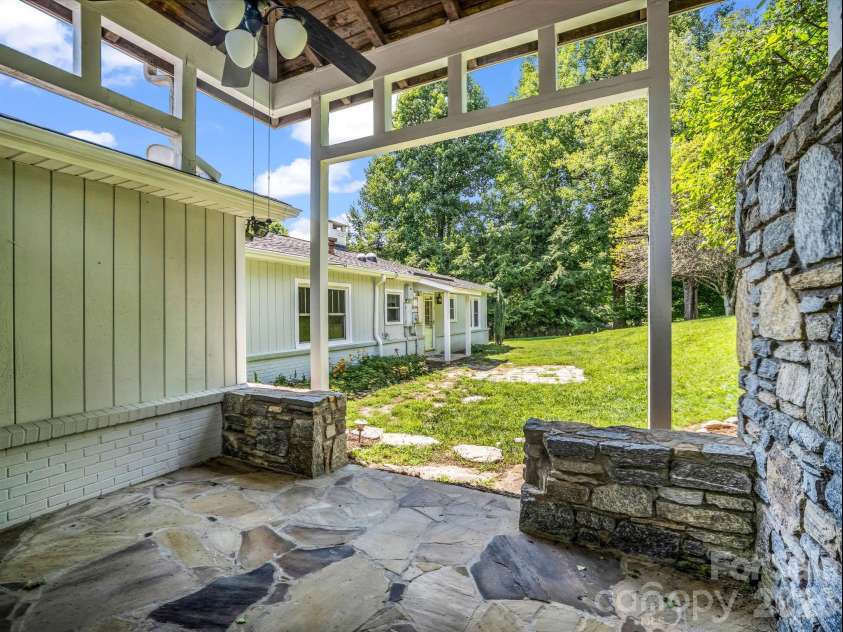 370 Orchard Circle, Laurel Park, NC 28739.  MLS# CAR4416531, YatesRealty ID 46572. Backyard view from covered patio