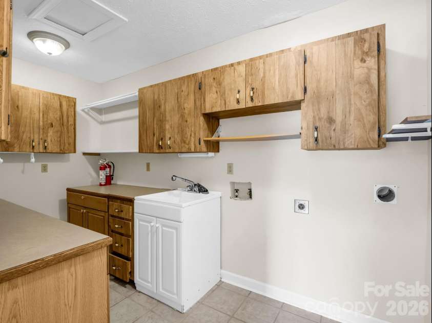 370 Orchard Circle, Laurel Park, NC 28739.  MLS# CAR4416531, YatesRealty ID 46572. Laundry Room