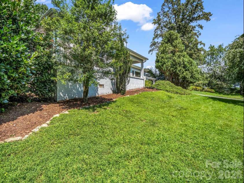 370 Orchard Circle, Laurel Park, NC 28739.  MLS# CAR4416531, YatesRealty ID 46572. Side Yard