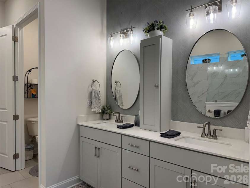 1104 Idyllic Lane, Waxhaw, NC 28173.  MLS# CAR4340433, YatesRealty ID 4658. Primary Bathoom - Double Sink -w/ Custom Cabinet - Private Toilet Room
