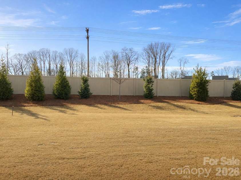 1104 Idyllic Lane, Waxhaw, NC 28173.  MLS# CAR4340433, YatesRealty ID 4658. Private Level Backyard