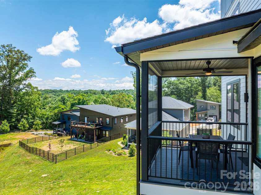 303 Iron Ridge Loop, Asheville, NC 28806.  MLS# CAR4353423, YatesRealty ID 4659. Back screened porch and view