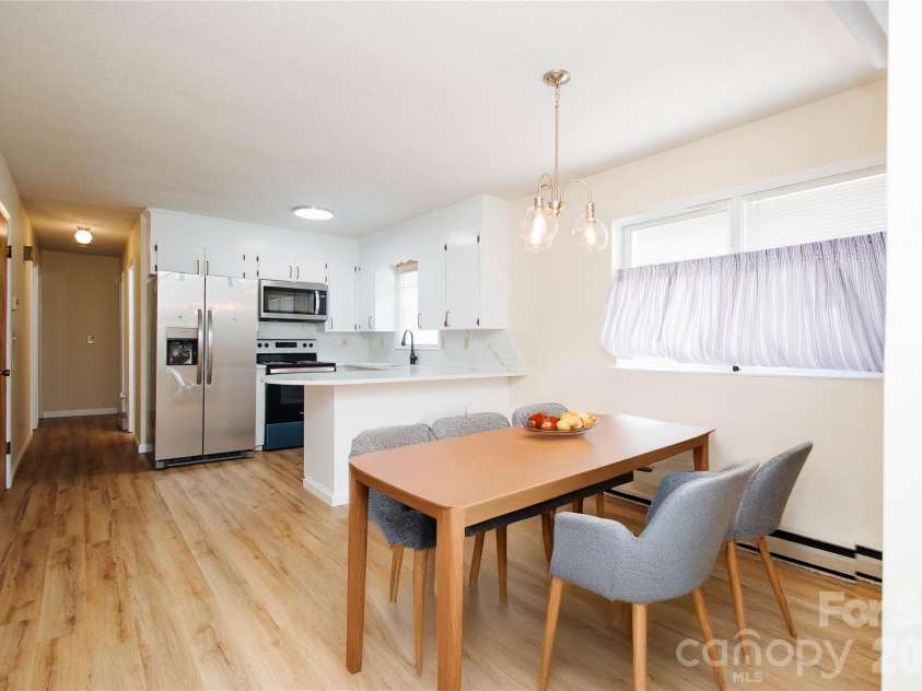 1559 Zion Hill Road, Marion, NC 28752.  MLS# CAR4416525, YatesRealty ID 46597. Kitchen staged with AI table and curtains