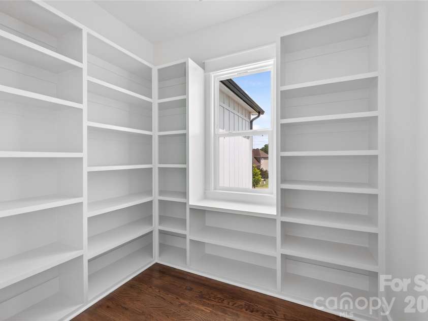 115 Augusta Lane, Shelby, NC 28150.  MLS# CAR4378533, YatesRealty ID 46613. A walk-in pantry with custom built-ins and enough space to keep everything organized without sacrificing style